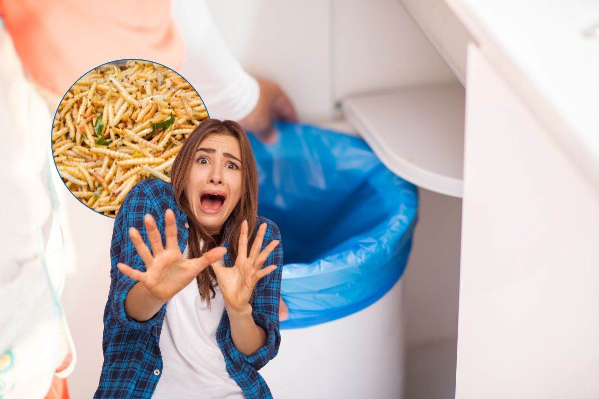 donna spaventata dai vermi nella pattumiera